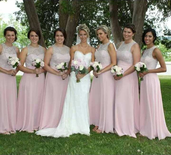 Bride and six bridesmaids in blush dresses, all styled