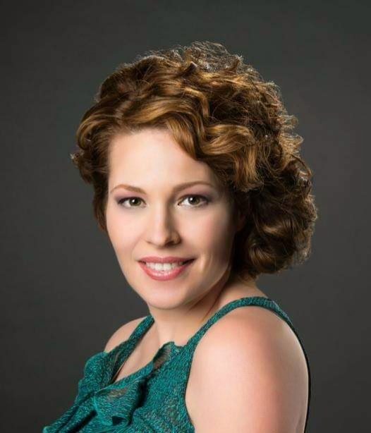 Short copper curls styled with volume