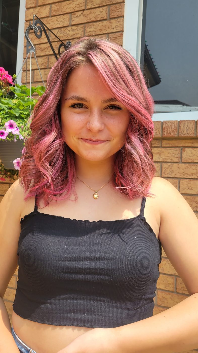 Shoulder-length pink balayage with soft waves